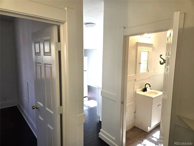 a kitchen with granite countertop a stove and a sink