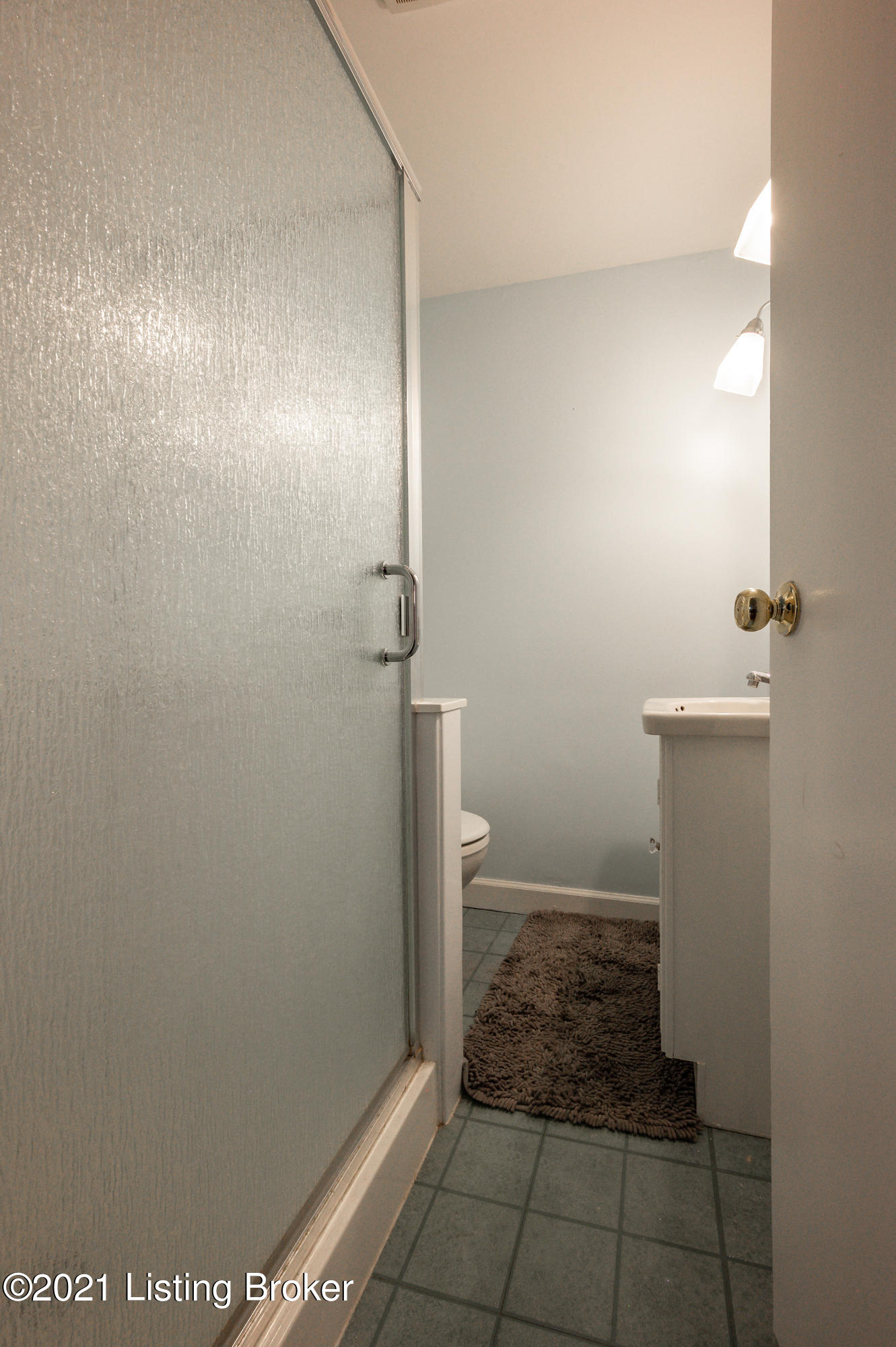 213 Don Allen Road Louisville, KY 40207 - Photo 39 of 53 Bedroom provides its own private full bathroom with sconce lighting over the mirror, a vanity with storage, and a shower
