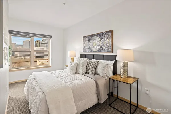 a bedroom with a bed and a window