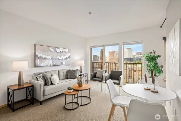 a living room with furniture and a large window