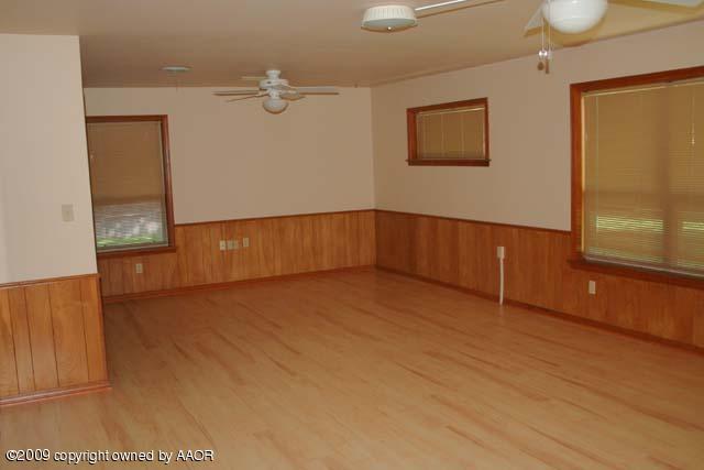 6904 Elmhurst Road Amarillo, TX 79106 - Photo 3 of 15 a view of an empty room with a window