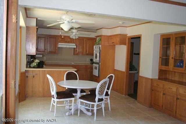 6904 Elmhurst Road Amarillo, TX 79106 - Photo 5 of 15 a dining room with furniture and window