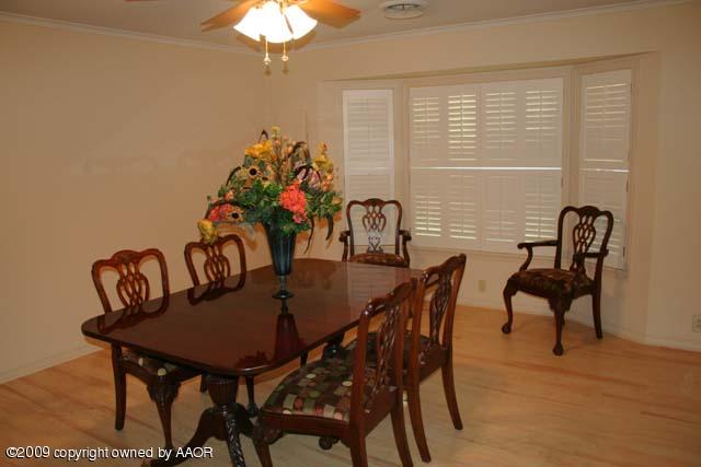 6904 Elmhurst Road Amarillo, TX 79106 - Photo 7 of 15 a view of a dining room with furniture and window