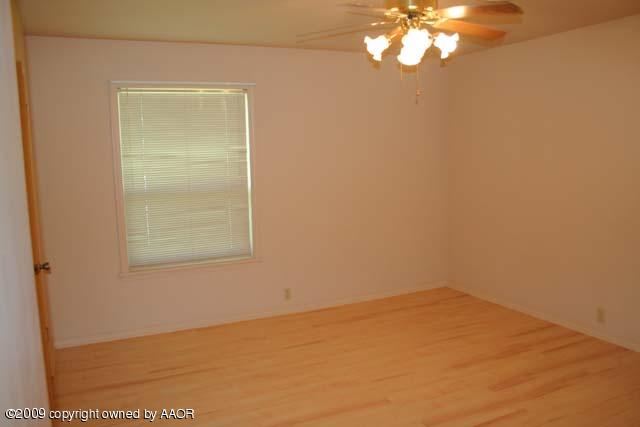 6904 Elmhurst Road Amarillo, TX 79106 - Photo 10 of 15 an empty room with a window