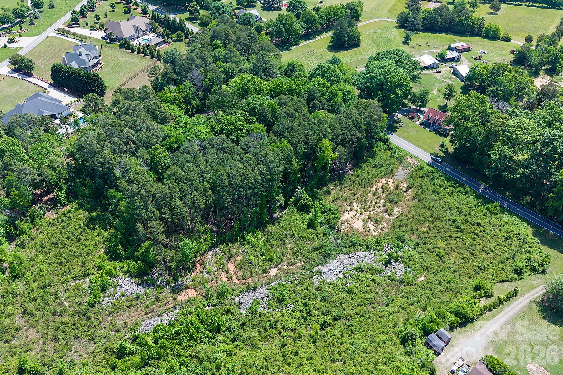 13745 Ramah Church Road Huntersville, NC 28078 - Photo 4 of 17 an aerial view of residential house with outdoor space and trees all around