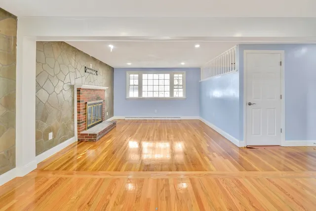 a view of an empty room with glass door