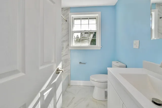 a bathroom with a toilet sink and a bathtub