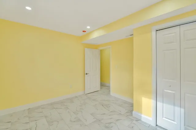 a view of a big room with a wooden walls