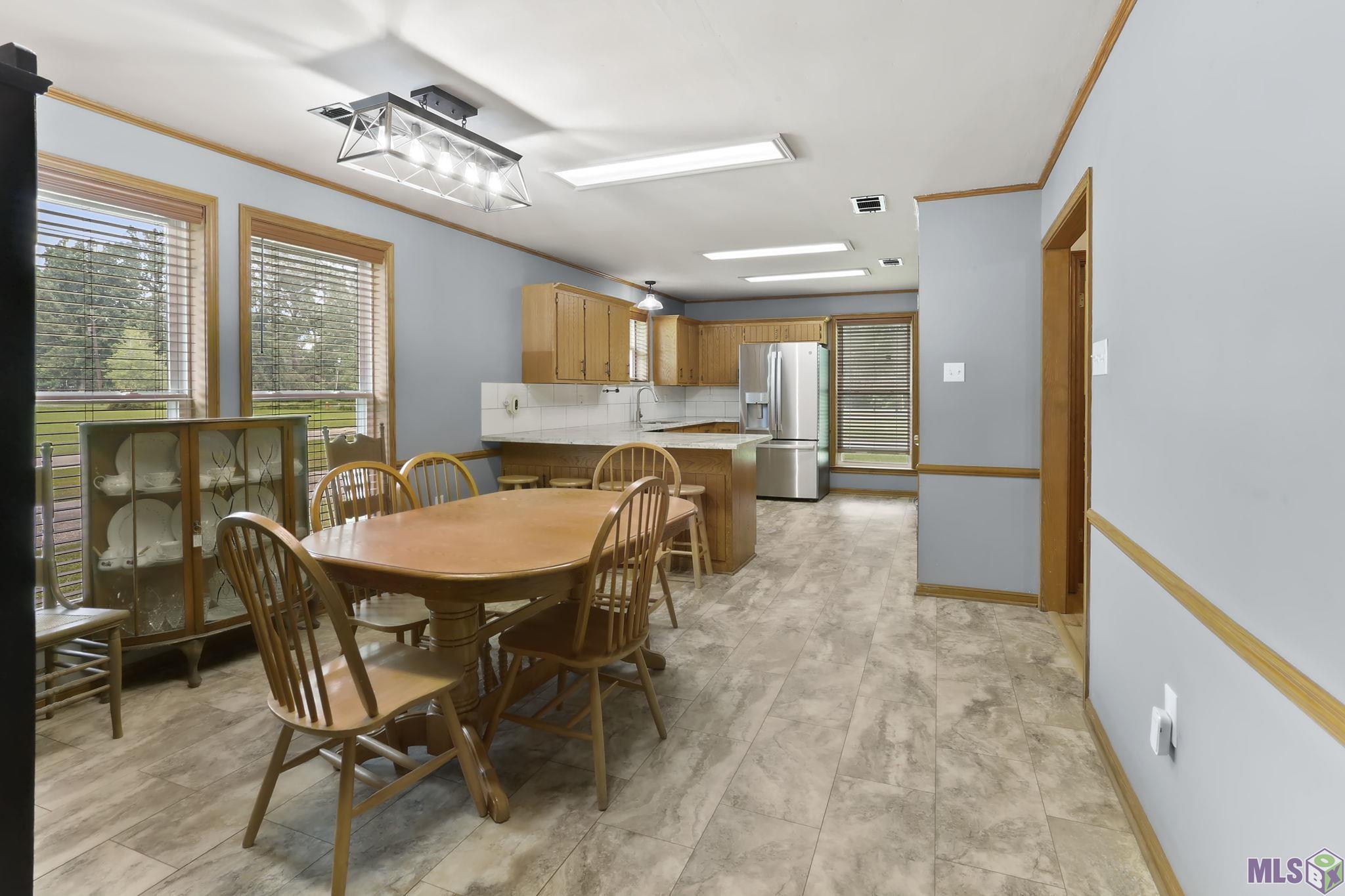 22185 Hoo Shoo Too Road Baton Rouge, LA 70817 - Photo 6 of 25 Kitchen and Dining Area