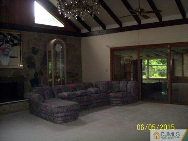 797 New Durham Road Edison, NJ 08817 - Photo 14 of 24 a living room with furniture and a large window