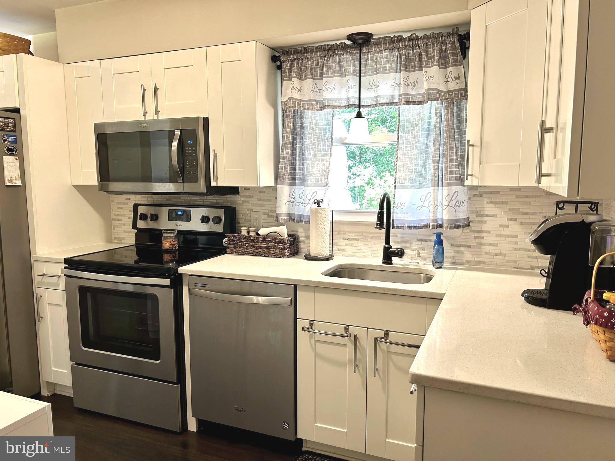 259 Hoffman Road Gettysburg, PA 17325 - Photo 3 of 23 a kitchen with a sink stove and microwave