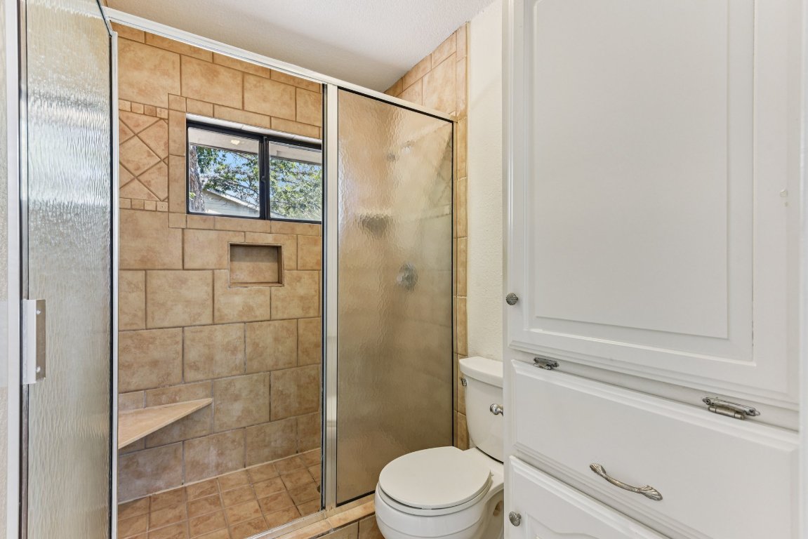 503 Hackberry Street Lockhart, TX 78644 - Photo 28 of 36 Full bath with a stall shower and toilet