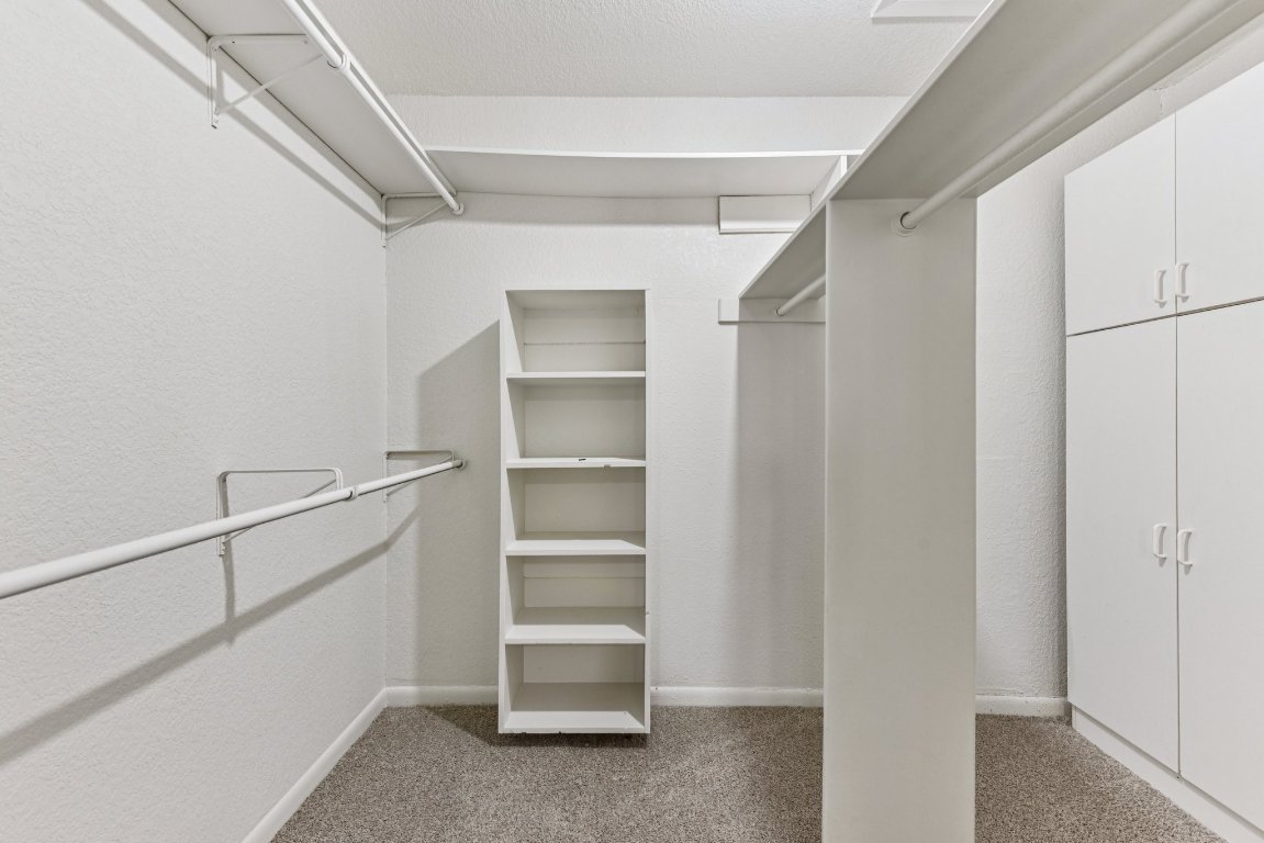 503 Hackberry Street Lockhart, TX 78644 - Photo 31 of 36 Walk in closet with light colored carpet