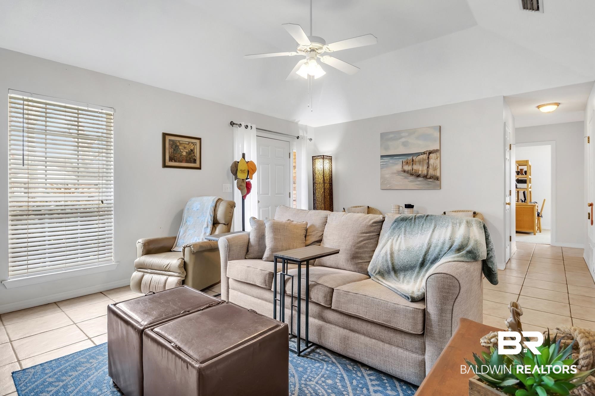 105 Cluster Oaks Court Foley, AL 36535 - Photo 13 of 26 Living room with light tile patterned flooring, ceiling fan, and lofted ceiling