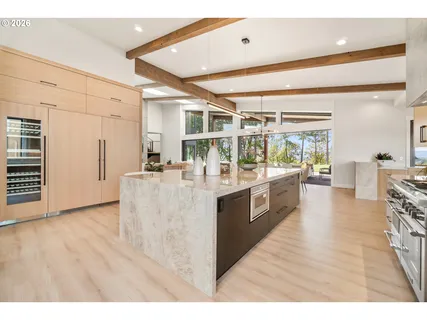 a kitchen with stainless steel appliances granite countertop a large counter top and sink