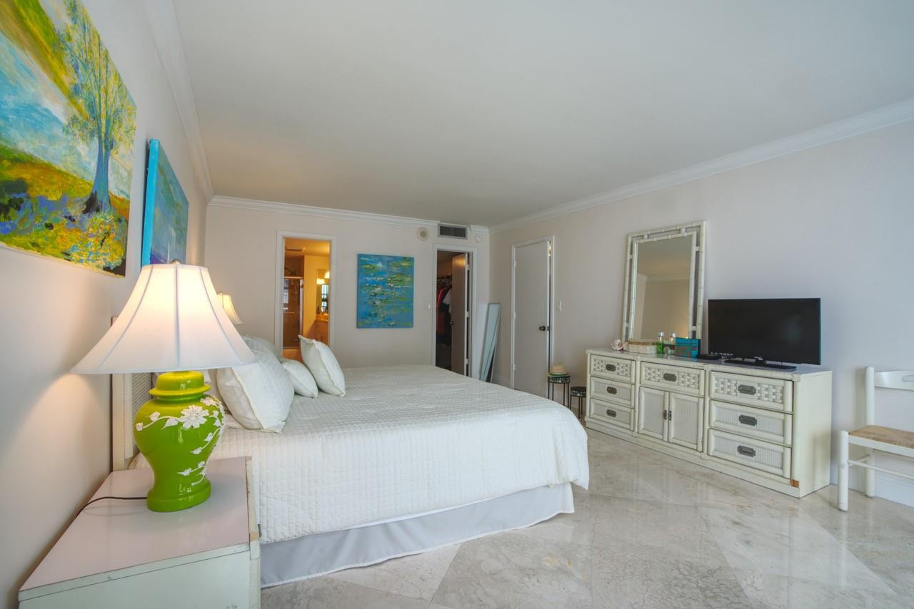 Undisclosed Address Pompano Beach, FL 33062 - Photo 11 of 55 a bedroom with a bed and flat screen tv