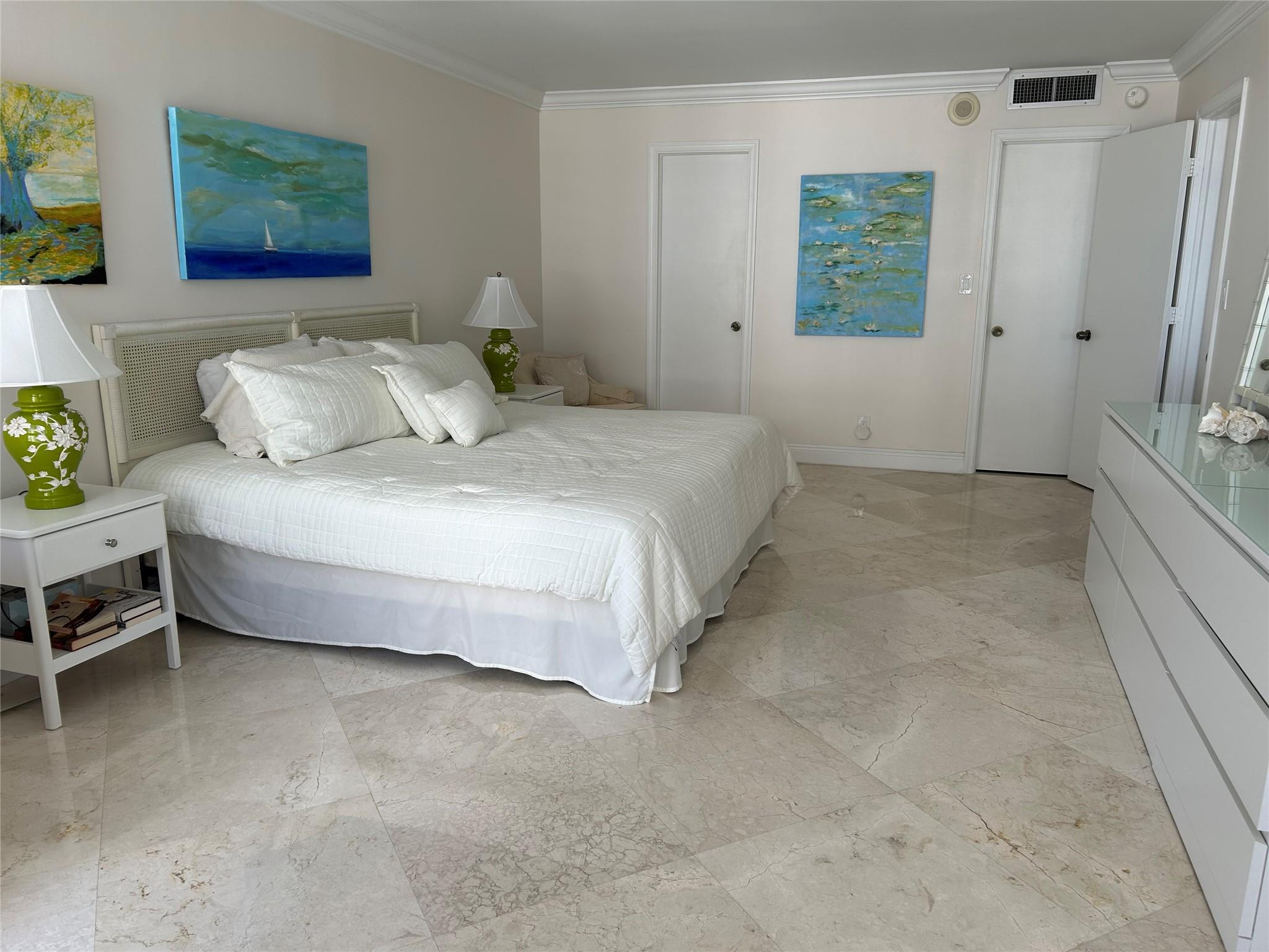 Undisclosed Address Pompano Beach, FL 33062 - Photo 12 of 55 a spacious bedroom with a bed and a window