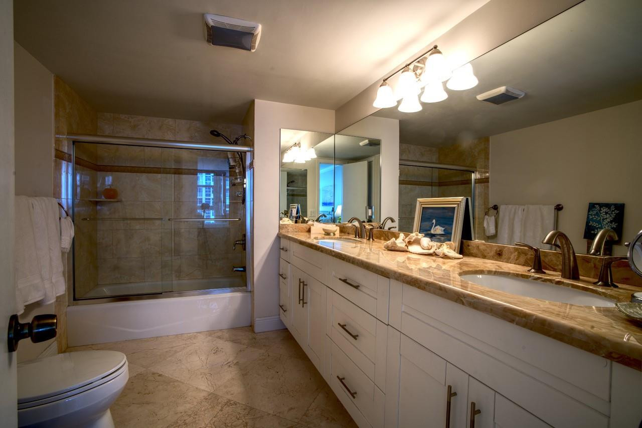 Undisclosed Address Pompano Beach, FL 33062 - Photo 15 of 55 a bathroom with a double vanity sink toilet and shower