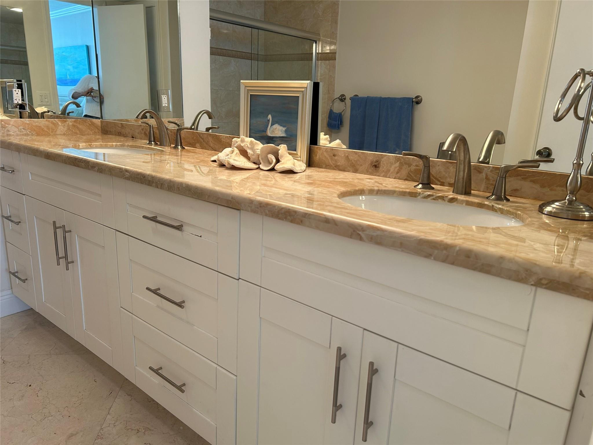 Undisclosed Address Pompano Beach, FL 33062 - Photo 16 of 55 a bathroom with double sink and a mirror