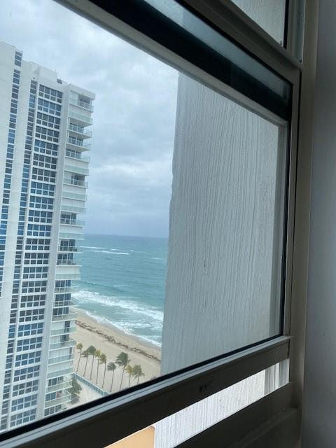 Undisclosed Address Pompano Beach, FL 33062 - Photo 22 of 55 a view of a glass door with a wooden floor