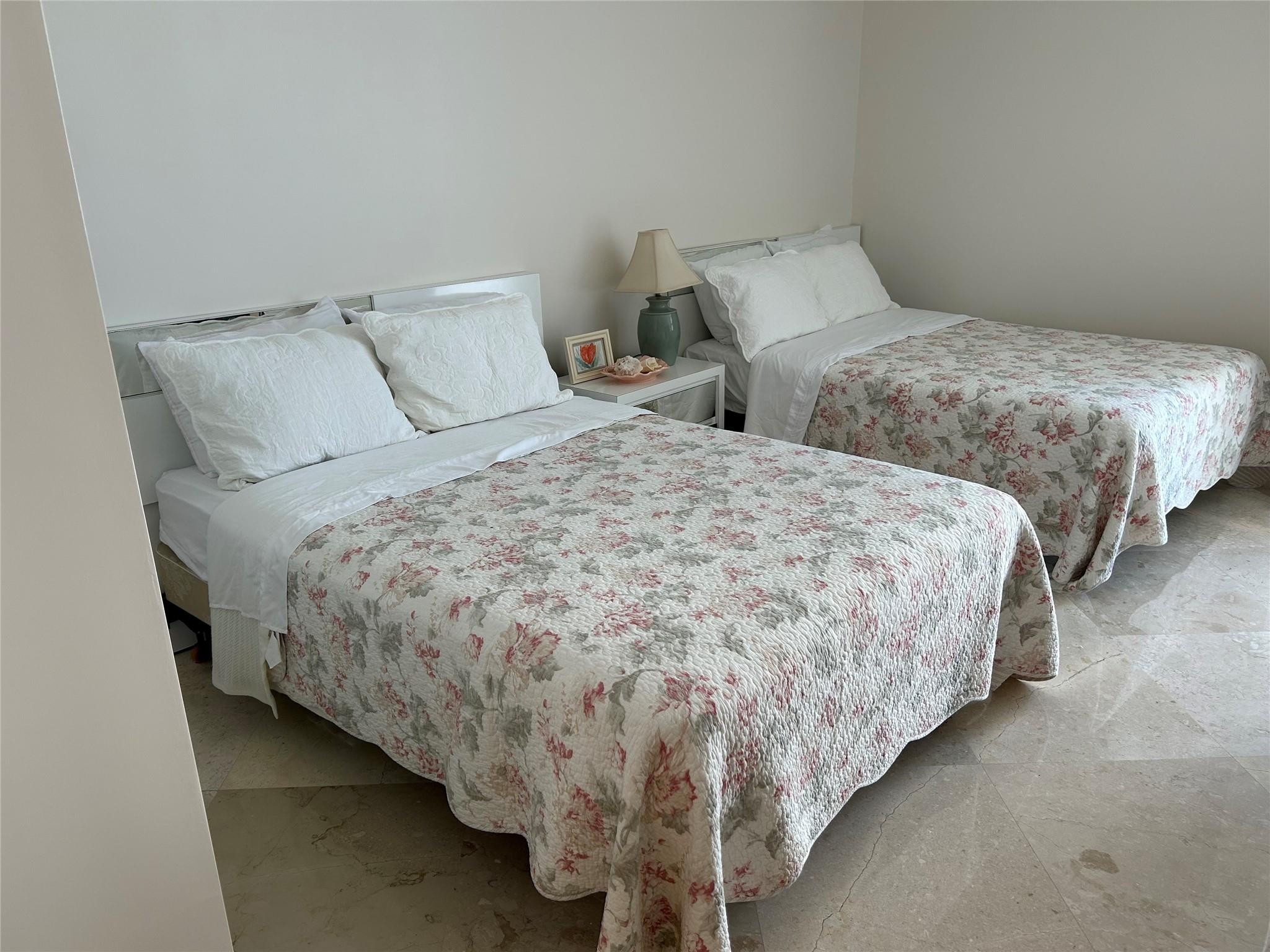 Undisclosed Address Pompano Beach, FL 33062 - Photo 24 of 55 a large bed sitting in a bedroom next to a window