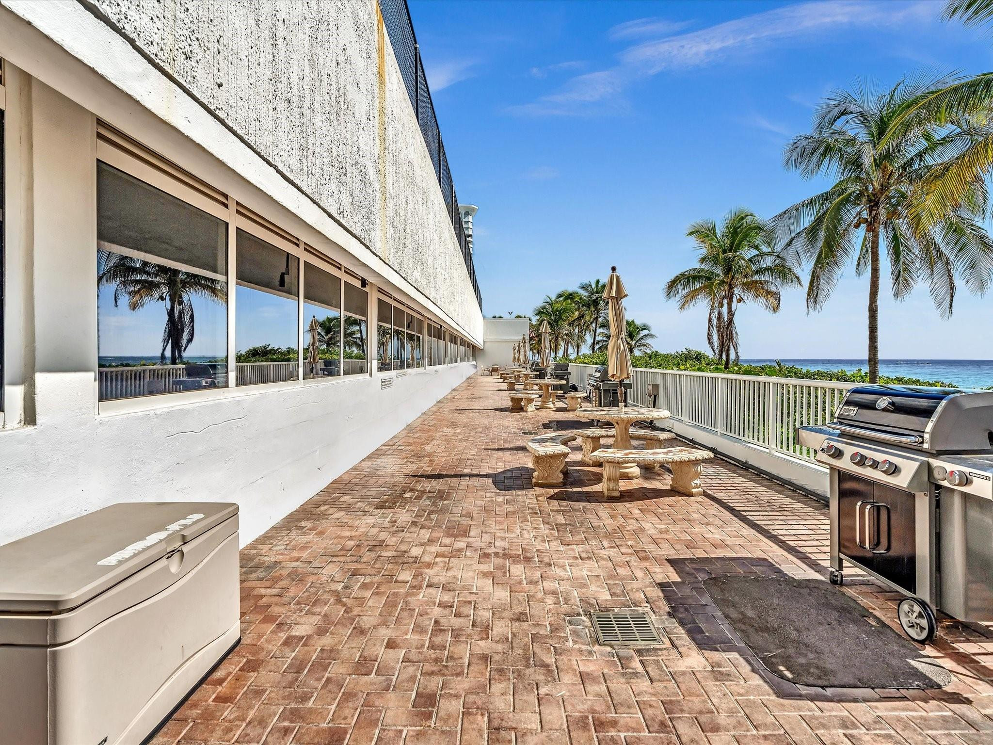 Undisclosed Address Pompano Beach, FL 33062 - Photo 39 of 55 a view of a swimming pool with a lounge chair