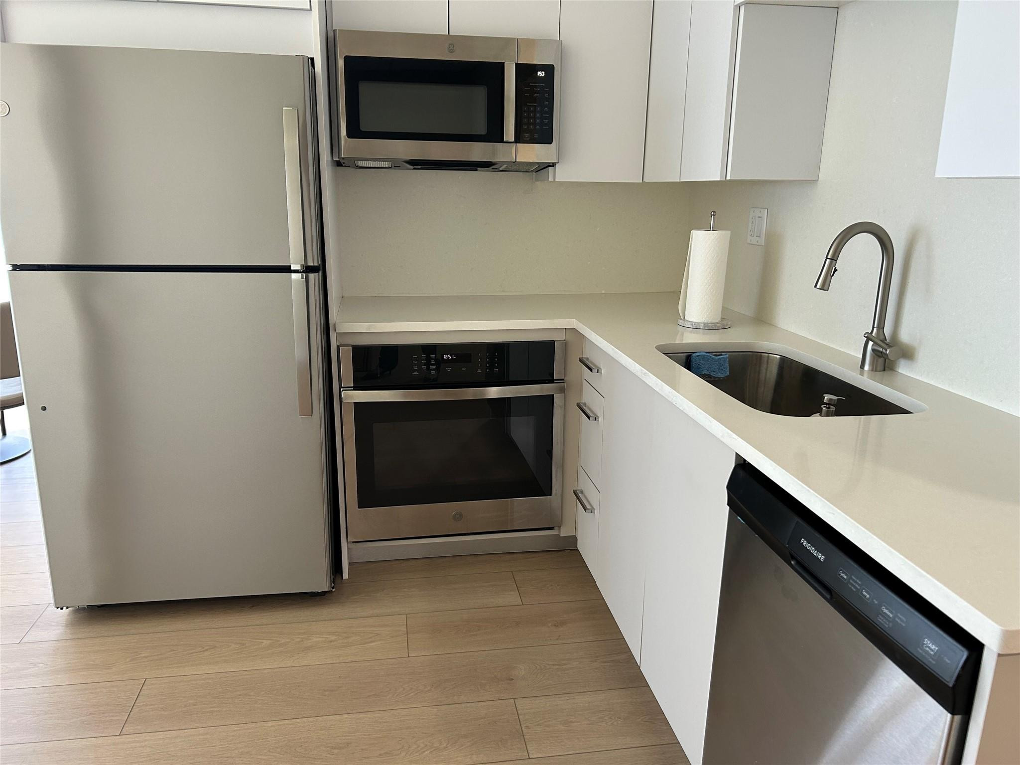 Undisclosed Address Pompano Beach, FL 33062 - Photo 48 of 55 a utility room with sink washer and dryer