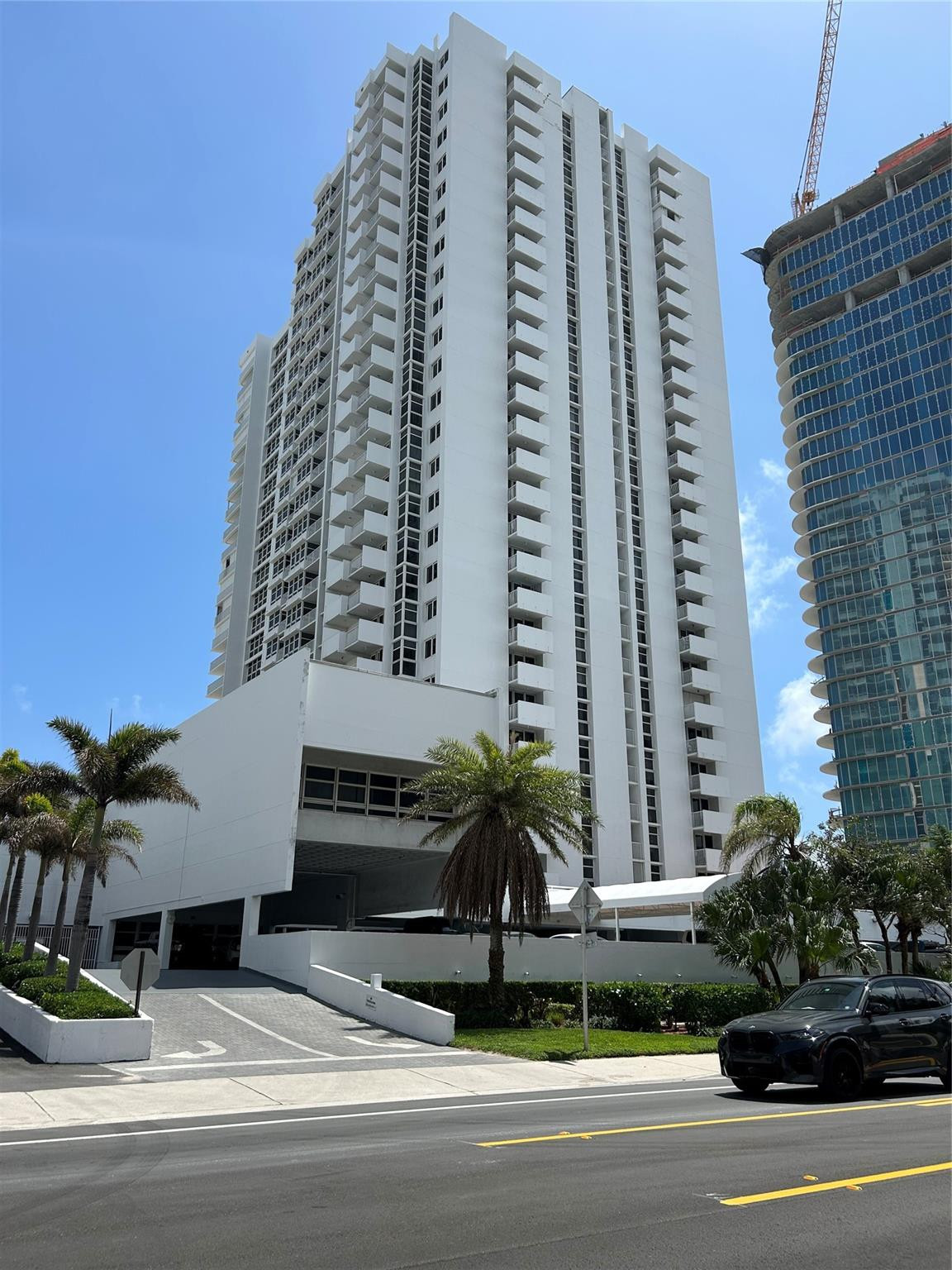 Undisclosed Address Pompano Beach, FL 33062 - Photo 53 of 55 a front view of a building with palm trees