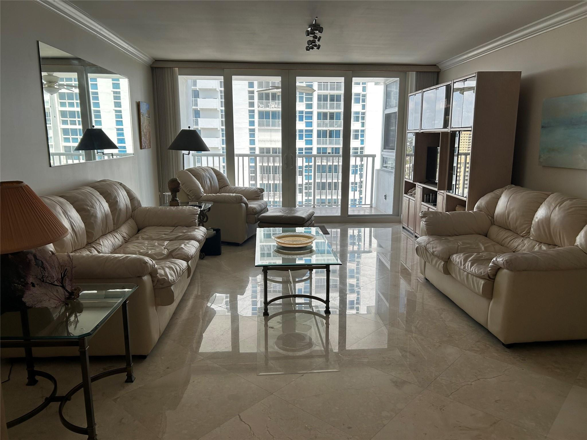 Undisclosed Address Pompano Beach, FL 33062 - Photo 8 of 55 a living room with furniture and a flat screen tv