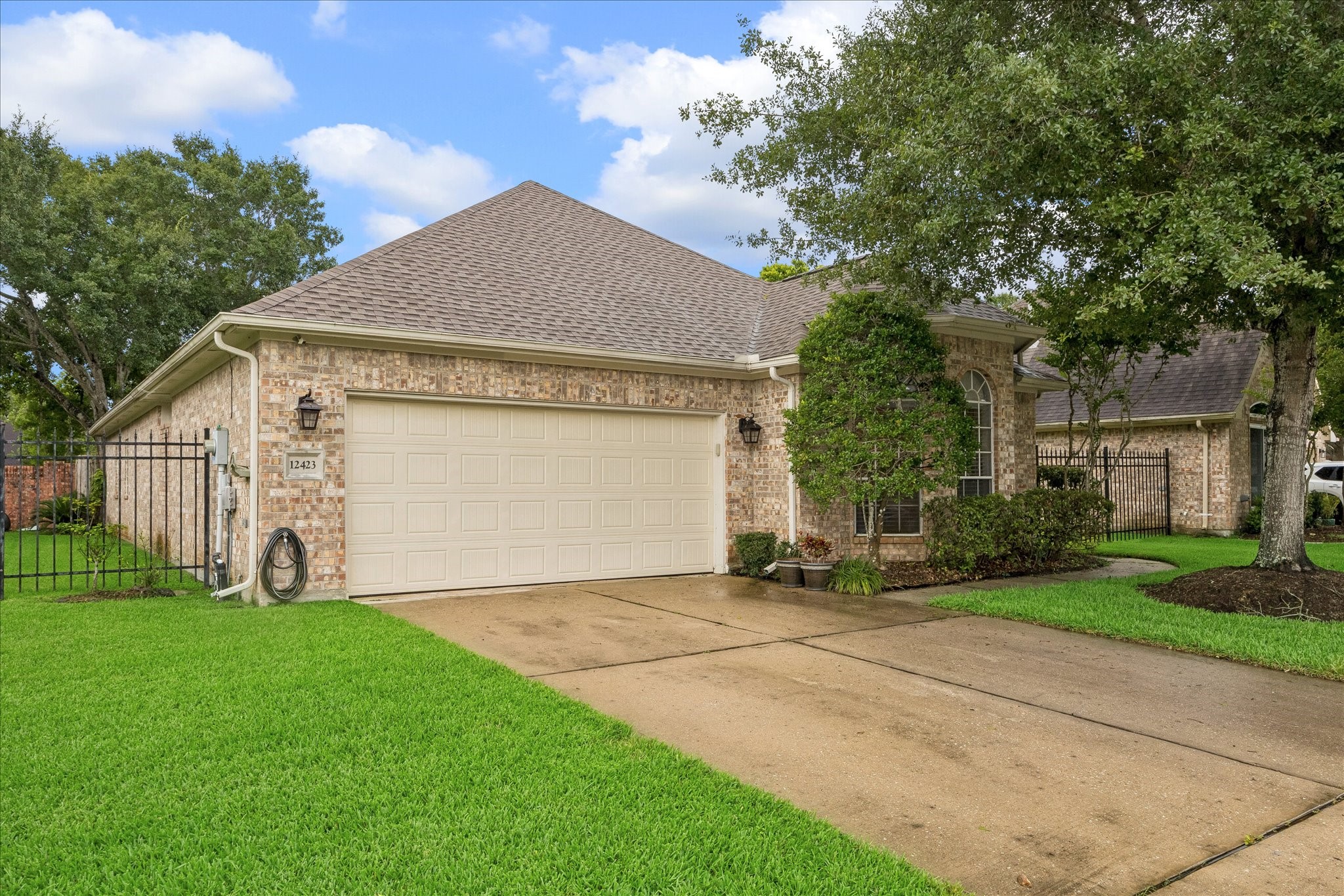 12423 Rutgers Park Court Houston, TX 77058 - Photo 1 of 29 a view of a house with a yard and tree