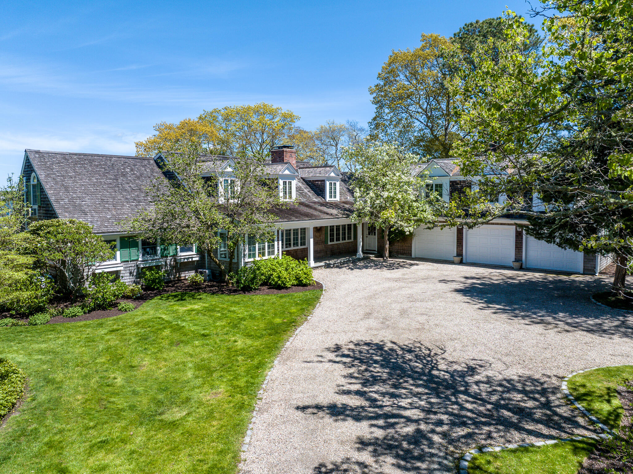 46 Great Bay Road Osterville, MA 02655 - Photo 48 of 54 a front view of a house with a yard