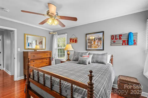 a bedroom with furniture and a chandelier