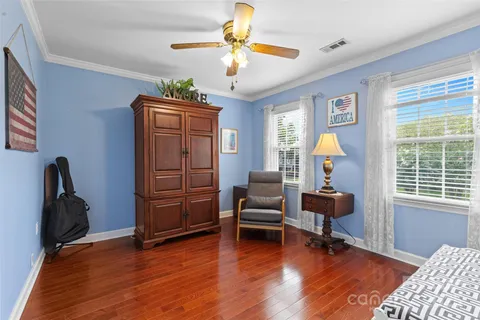 a view of a livingroom with furniture and a window