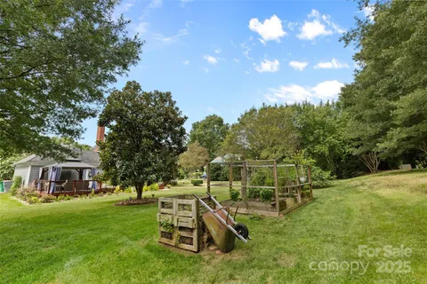 a view of a chair and table on the garden