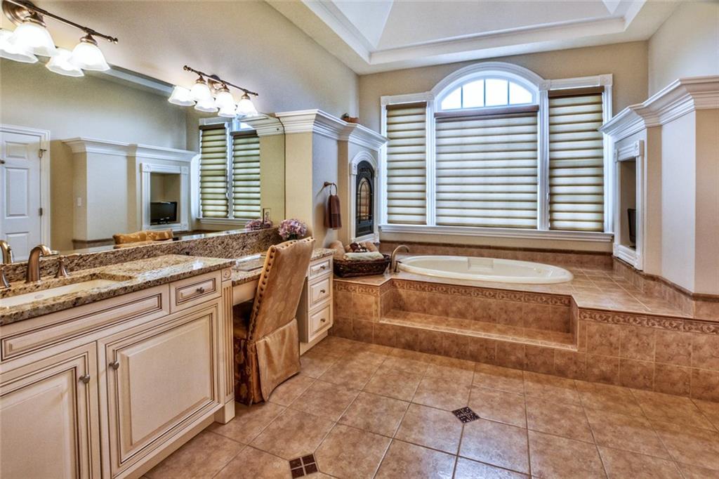 208 Logan Road Gibsonia, PA 15044 - Photo 11 of 25 Luxurious master bathroom with jetted tub, tiled shower with body jets, dual vanities and access to the incredible patio and pergola.