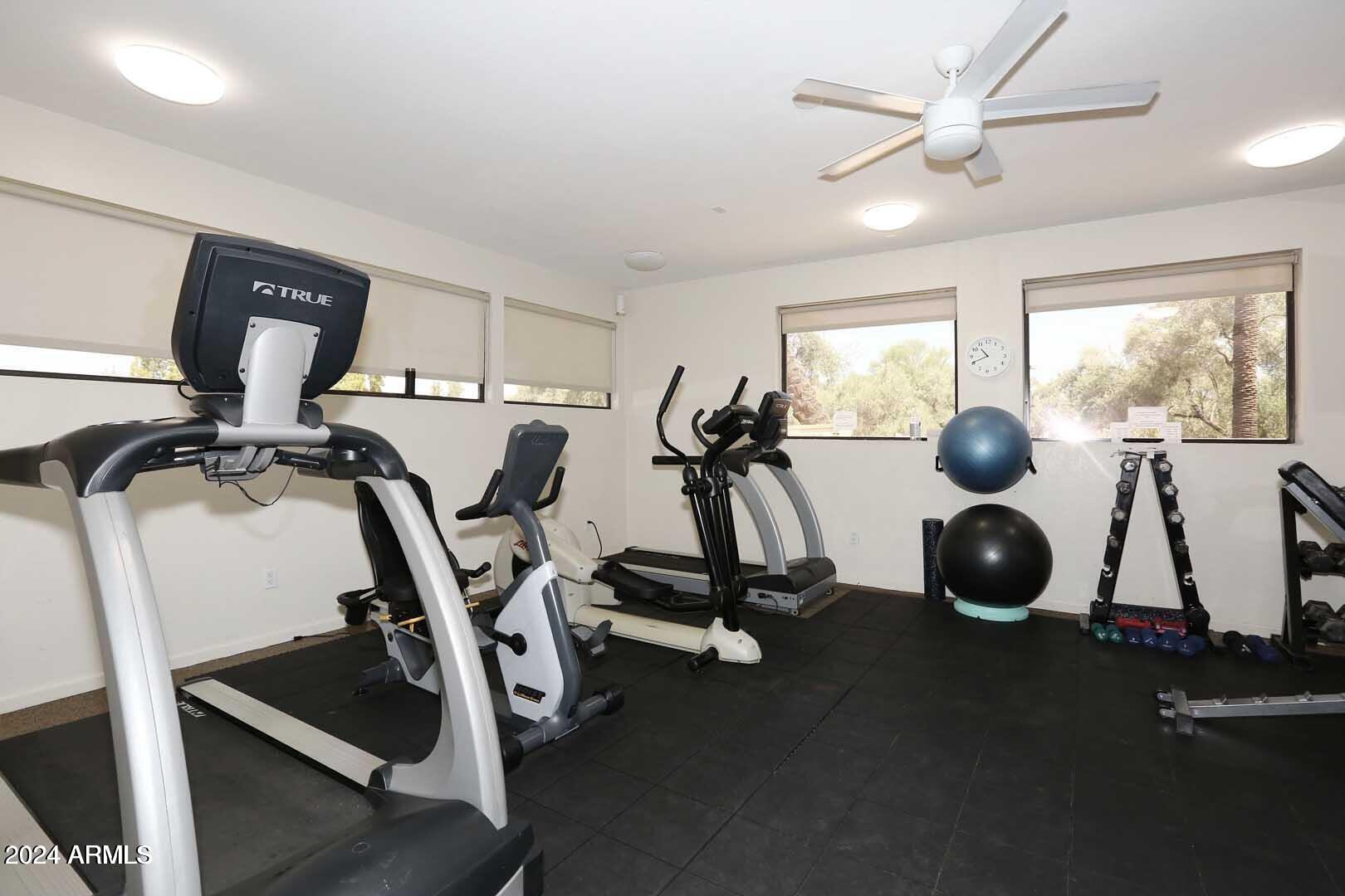 9705 East Mountain View Road, Unit 1021 Scottsdale, AZ 85258 - Photo 14 of 14 a room with gym equipment