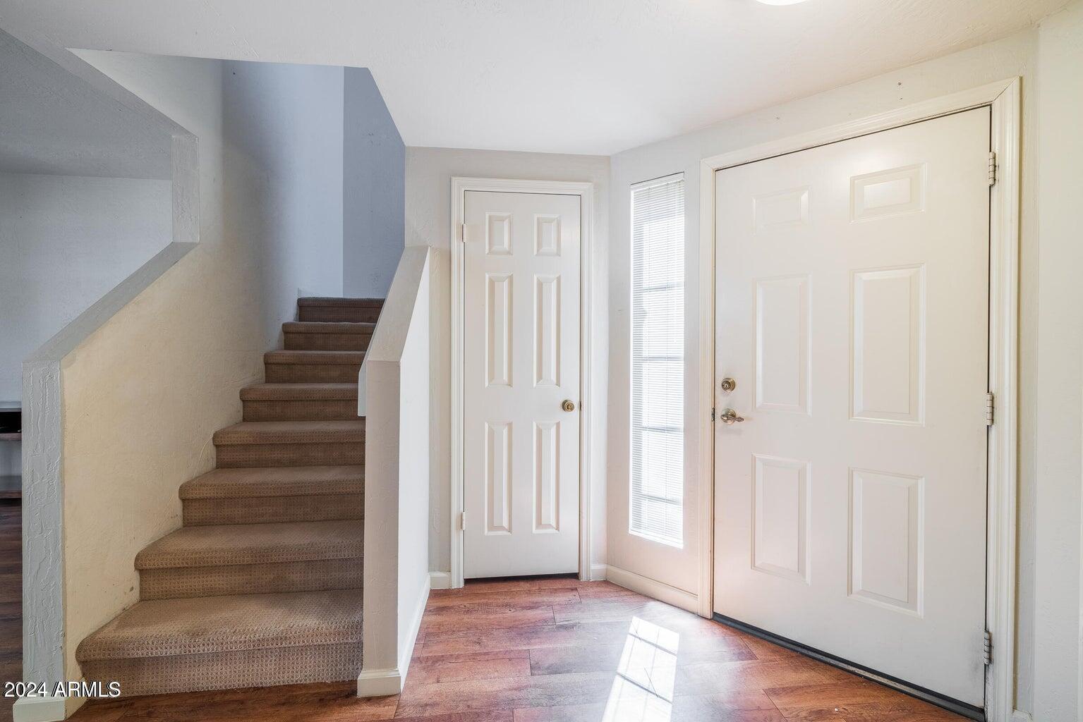 9705 East Mountain View Road, Unit 1021 Scottsdale, AZ 85258 - Photo 8 of 14 a view of an entryway with stairs