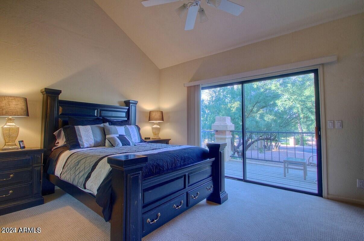 9705 East Mountain View Road, Unit 1021 Scottsdale, AZ 85258 - Photo 9 of 14 a bed room with a bed and a balcony