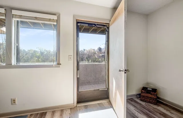 a view of a closet area with living area