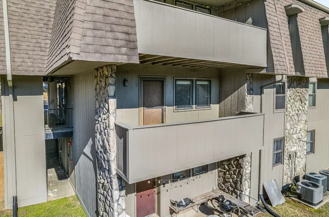 a front view of a house with many windows