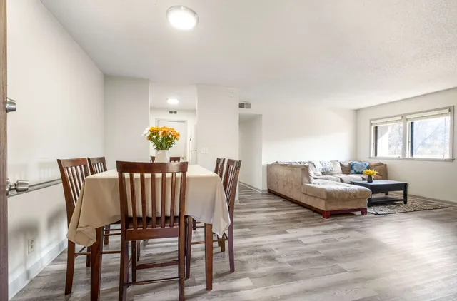 a living room with furniture and a table