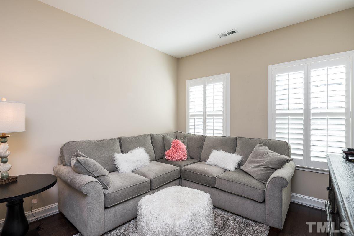 4025 Periwinkle Blue Lane Raleigh, NC 27612 - Photo 11 of 23 a living room with furniture and a window