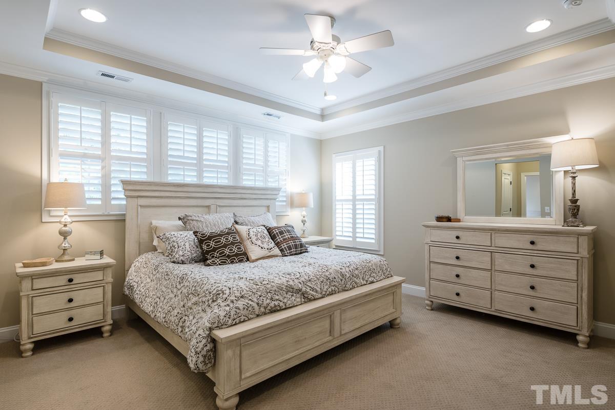 4025 Periwinkle Blue Lane Raleigh, NC 27612 - Photo 12 of 23 a bedroom with a bed and a dresser