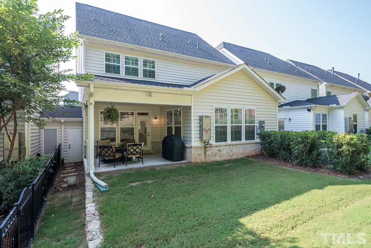 4025 Periwinkle Blue Lane Raleigh, NC 27612 - Photo 22 of 23 a view of a house with backyard porch and garden