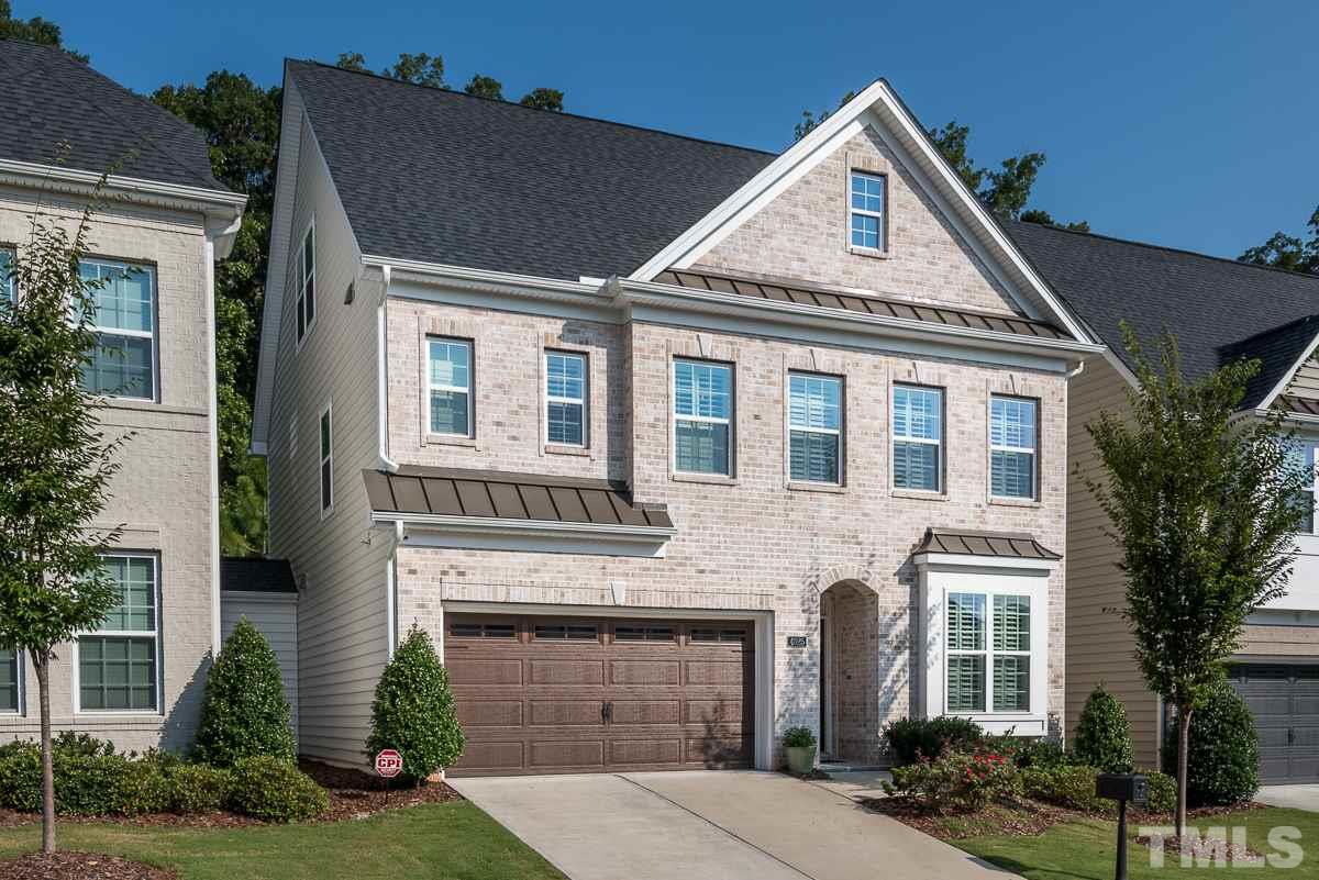 4025 Periwinkle Blue Lane Raleigh, NC 27612 - Photo 23 of 23 a front view of a house with a yard