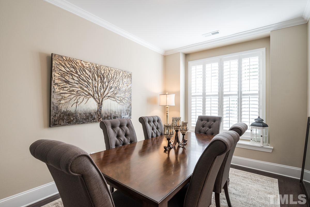 4025 Periwinkle Blue Lane Raleigh, NC 27612 - Photo 3 of 23 a view of a dining room with furniture window and outside view