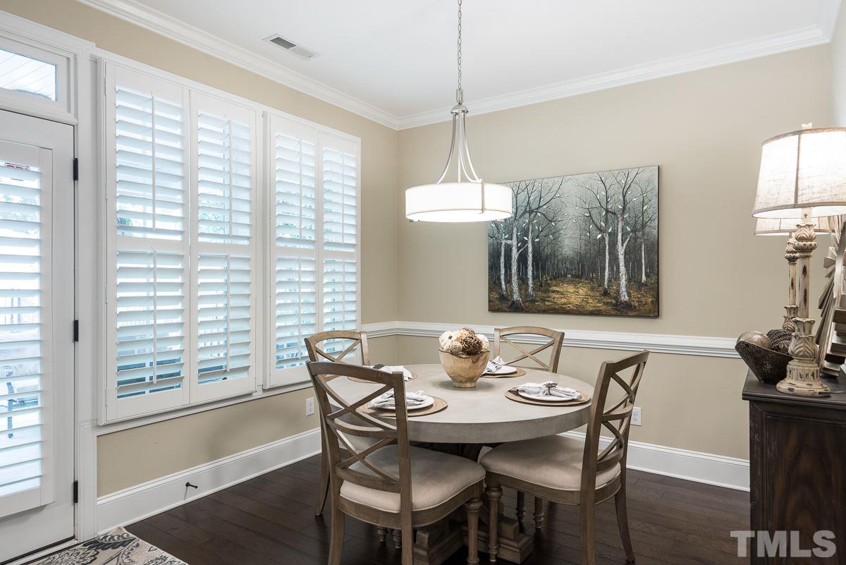 4025 Periwinkle Blue Lane Raleigh, NC 27612 - Photo 8 of 23 a view of a dining room with furniture window and outside view