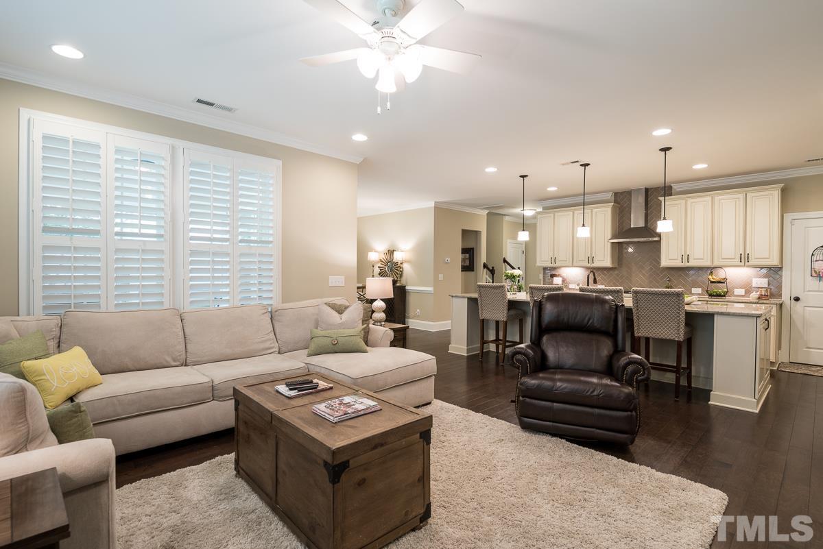 4025 Periwinkle Blue Lane Raleigh, NC 27612 - Photo 10 of 23 a living room with furniture and a large window