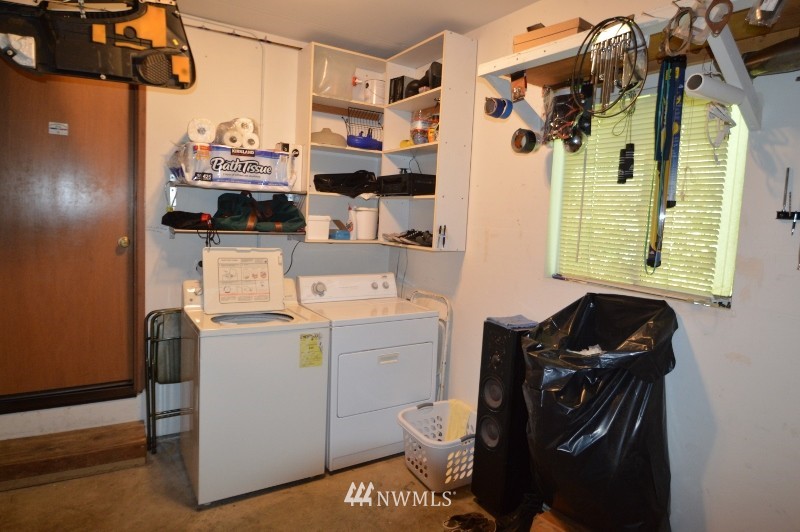 20607 West Richmond Road Bothell, WA 98021 - Photo 11 of 16 a view of a storage & utility room with washer and dryer