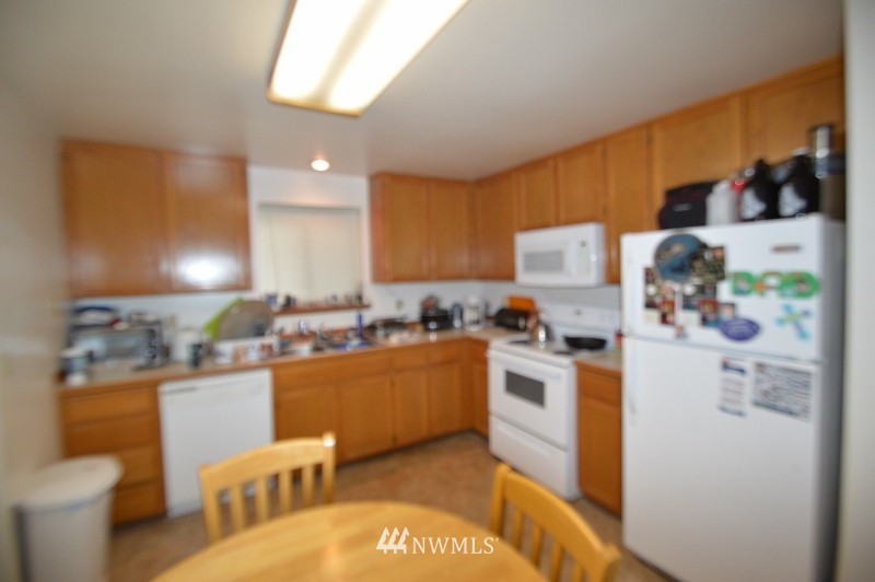 20607 West Richmond Road Bothell, WA 98021 - Photo 12 of 16 a kitchen with a sink appliances and cabinets